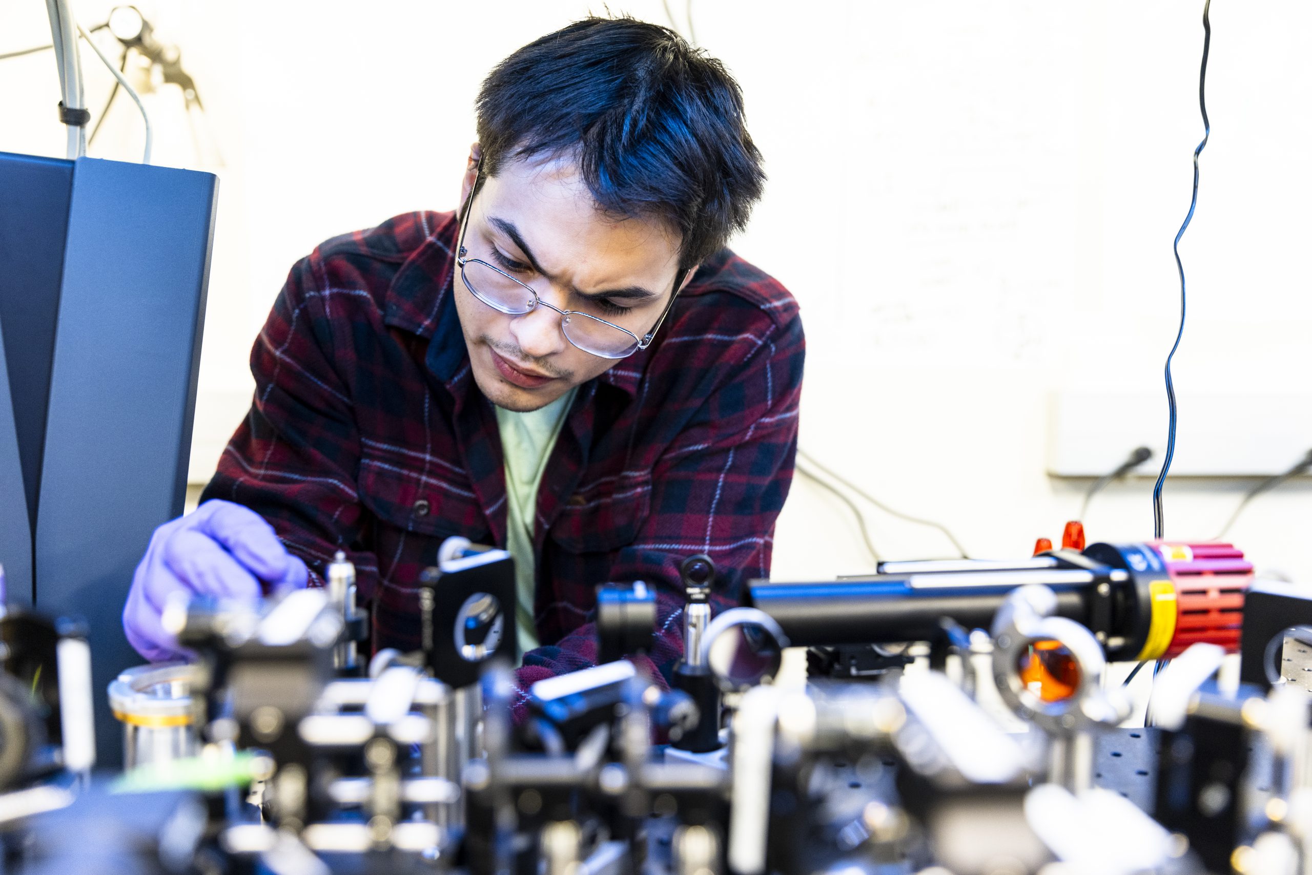 Enrique Garcia working on an antenna in QuantumX lab.