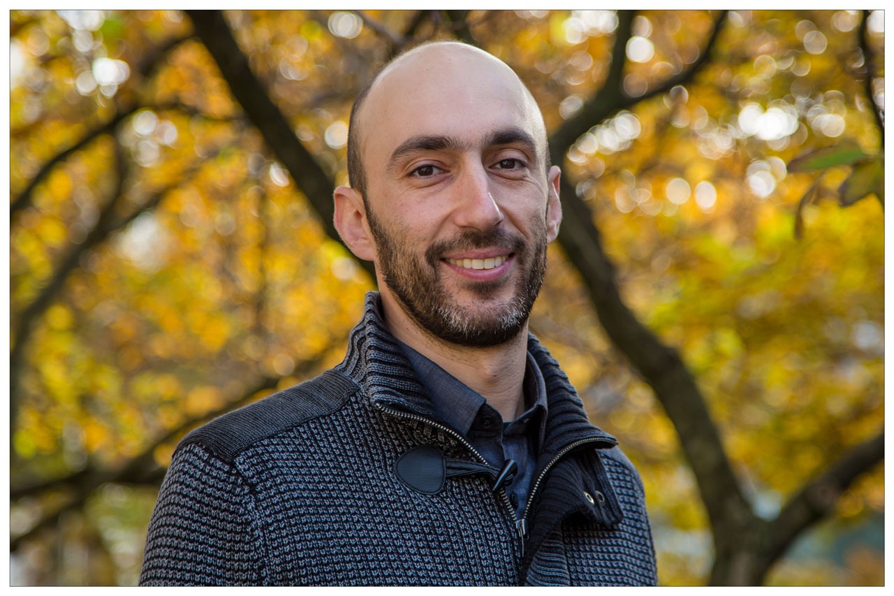 Mark Rudner outside in front of fall foliage